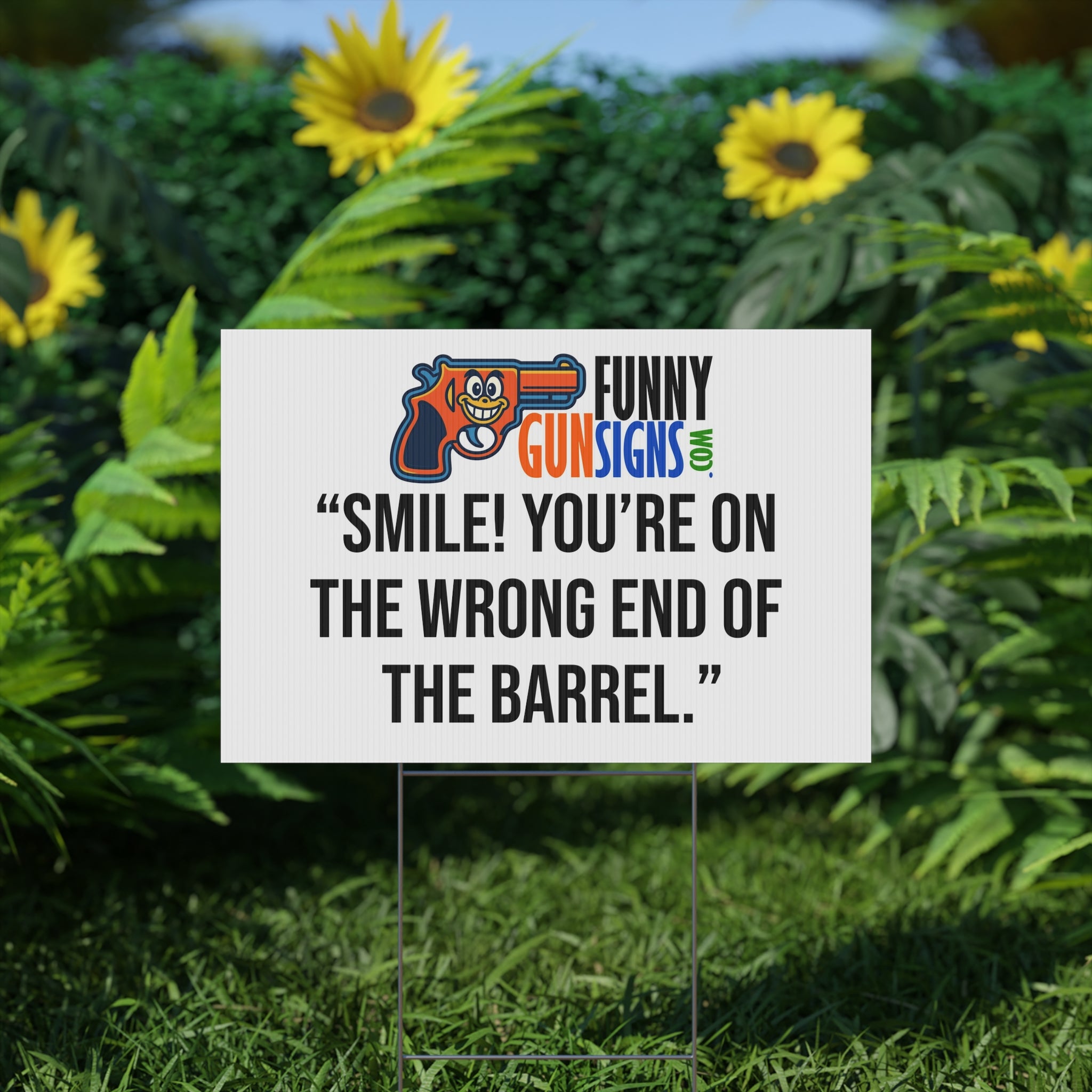 “Smile! You’re on  the wrong end of  the barrel.” | Funny Gun Signs