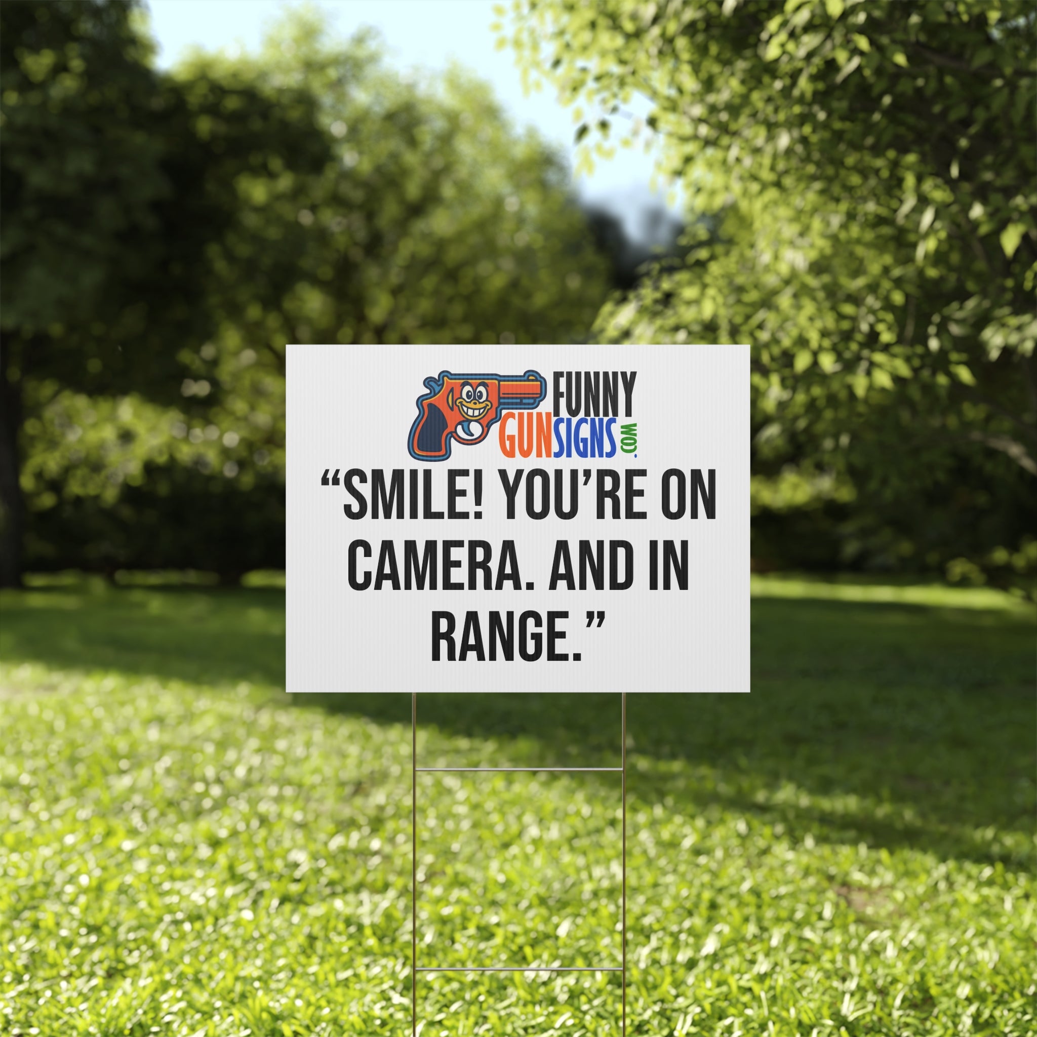 “Smile! You’re on camera. And in range.” FUNNY GUN SIGNS